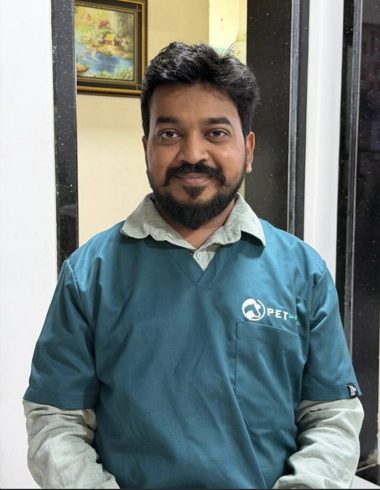 Dr Priyesh of the Pet 24-7 veterinary team, wearing Pet 24-7 scrubs